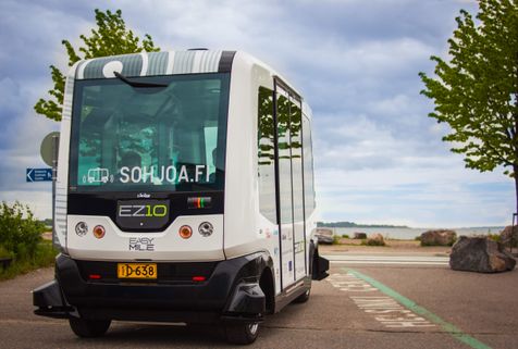 EZ-10 Robot bus with a seaside background
