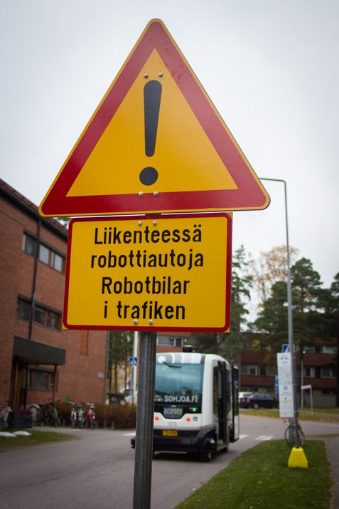 EZ-10 robot bus in Otaniemi, Espoo, Finland with a robot bus warning side in front